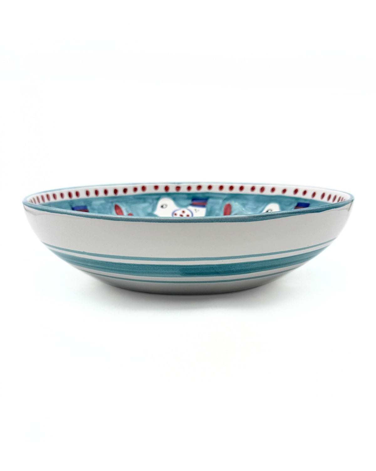 Dipinto Ceramics Amalfi bolle, detalj av den turkise kanten med hvite fugler, røde og blå dekorpunkter, samt turkise striper